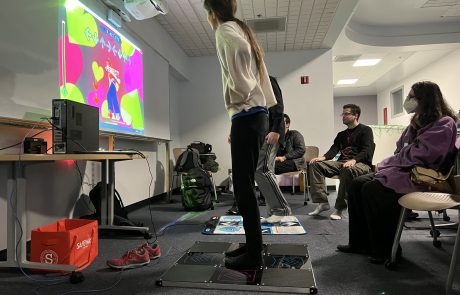 Photo of people playing a dancing video game
