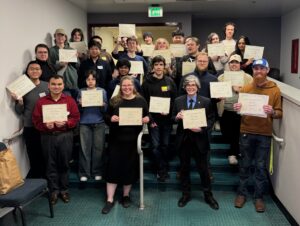 A group of students holding certificates.